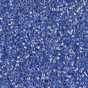Close-up of numerous small blue glass beads with white centers.