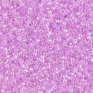 Close-up of small translucent pink beads scattered densely.