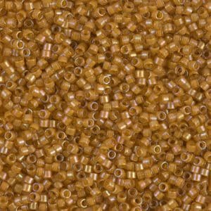 Close-up of numerous small golden beads.