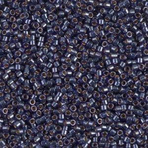 Deep sapphire cylindrical glass beads close-up