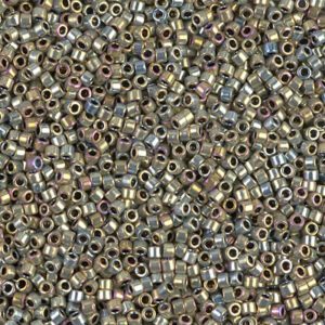 Close-up of numerous small, metallic cylindrical beads scattered densely.