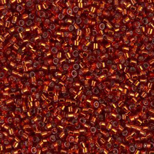 Close-up of numerous small, shiny reddish-brown beads.