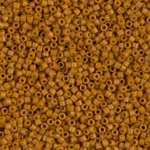 Close-up of small, cylindrical brown beads with central holes.