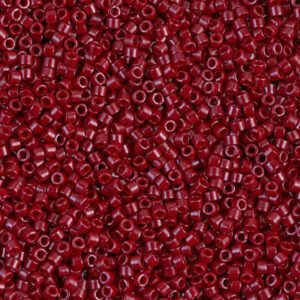 Close-up of numerous small red beads with a glossy finish.