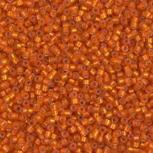 Close-up of shiny orange seed beads.