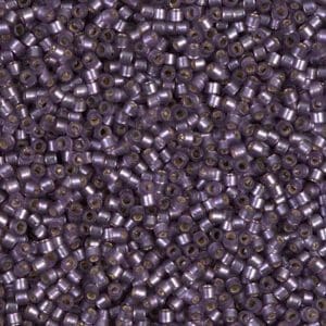 Close-up of numerous small, metallic cylindrical pellets.