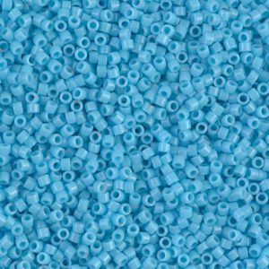 Close-up of tiny blue seed beads scattered uniformly.