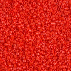 Close-up of numerous small red beads with central holes.