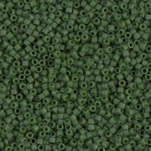 Close-up of many small green seed beads.