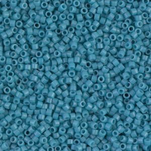 Close-up of numerous small turquoise beads densely packed together.