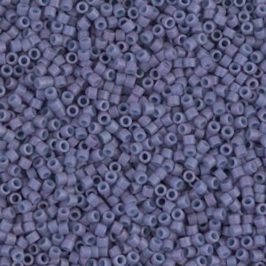 Close-up of numerous small, purple beads densely packed together.