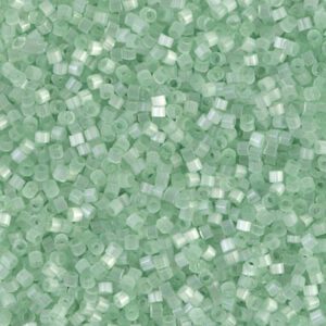 Close-up of small green translucent square beads.