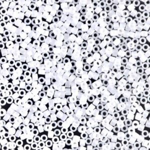 Black and white abstract pattern with scattered circles and dots.