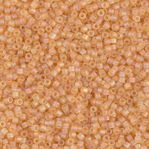 Close-up of small peach-colored beads scattered densely.