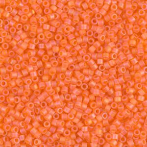 Close-up of small orange beads with a matte finish.
