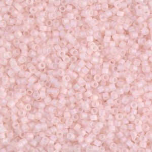 Close-up of tiny light pink beads densely packed together.