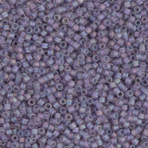 Close-up of numerous small lavender beads with a matte finish.