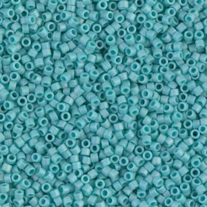 Close-up of small turquoise seed beads.