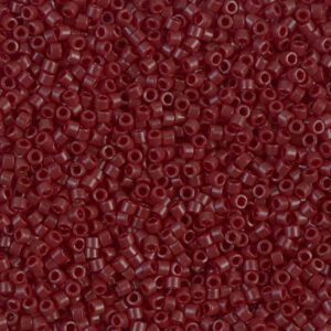 Close-up of small, red cylindrical beads densely packed together.