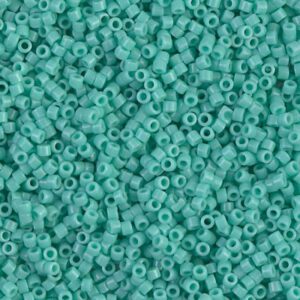 Close-up of many small turquoise beads.