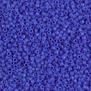 Close-up of numerous small blue beads with holes.