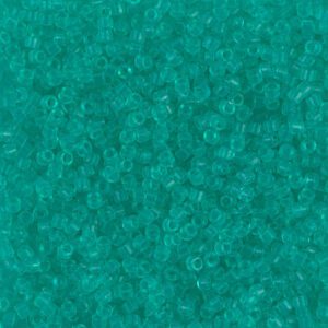 Close-up of turquoise beads with intricate patterns.
