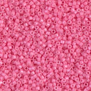 Close-up of many small pink seed beads.