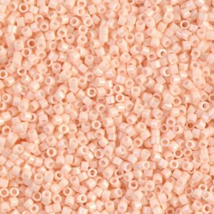 Close-up of small peach-colored beads scattered densely.