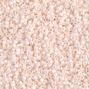 Close-up of small, pale pink beads with a pearly finish.