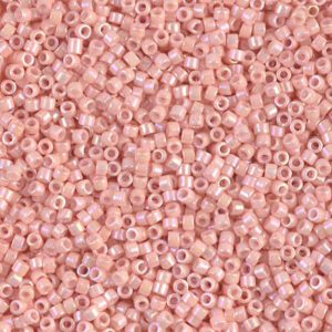 Close-up of numerous small pink beads scattered together.