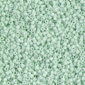 Close-up of many tiny mint green beads.