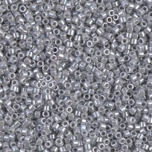 Close-up of numerous small silver beads scattered densely.