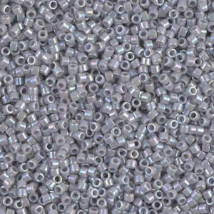 Close-up of small, translucent gray beads with holes in the center.