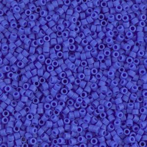 Close-up of small blue cylindrical beads scattered densely.