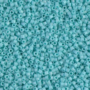 Close-up of small turquoise beads scattered together.