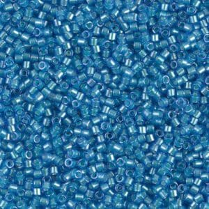 Close-up of numerous small blue beads with transparent centers.