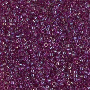 Close-up of small, translucent purple beads with silver linings.