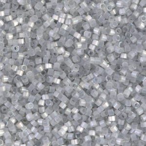 Close-up of small transparent plastic pellets on a surface.