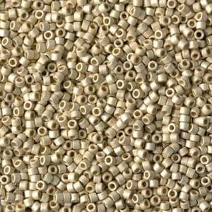 Close-up of numerous small beige cylindrical beads.