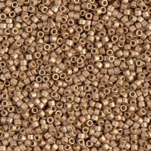 Close-up of small, shiny golden beads densely packed together.