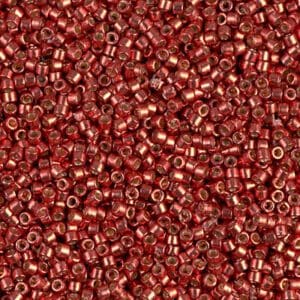 Close-up of tiny red metallic beads densely packed together.