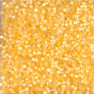 Close-up of small, shiny golden beads.