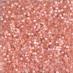 Close-up of small pink plastic beads scattered together.