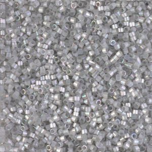 Close-up of small, translucent plastic pellets scattered densely.