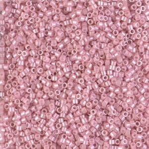 Close-up of small, pink cylindrical beads.