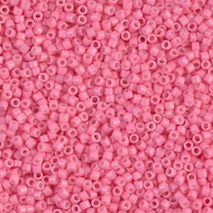 Close-up of small pink seed beads scattered densely.
