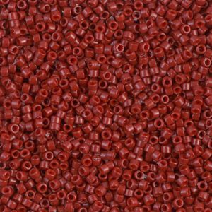 Close-up of numerous small red beads with a glossy finish.