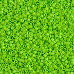 Close-up of vibrant green seed beads scattered densely.