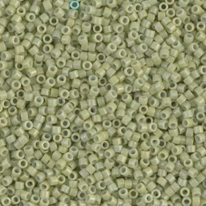 Close-up of numerous small green seed beads.