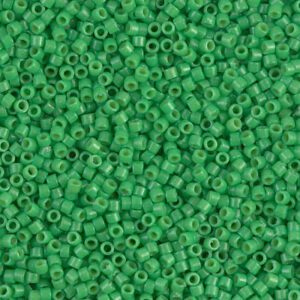 Close-up of numerous small green beads with holes.